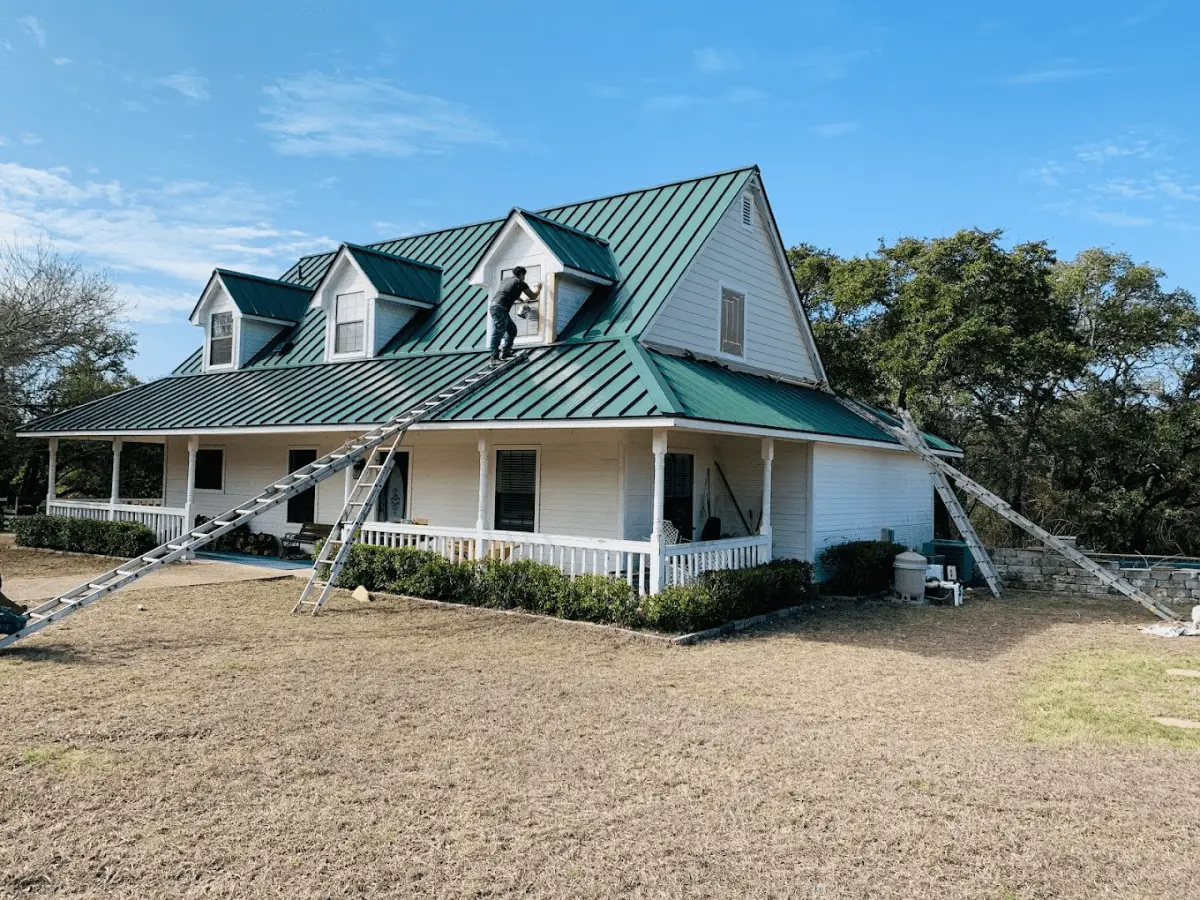 Ark worker installing a new metal roof on a Pflugerville home