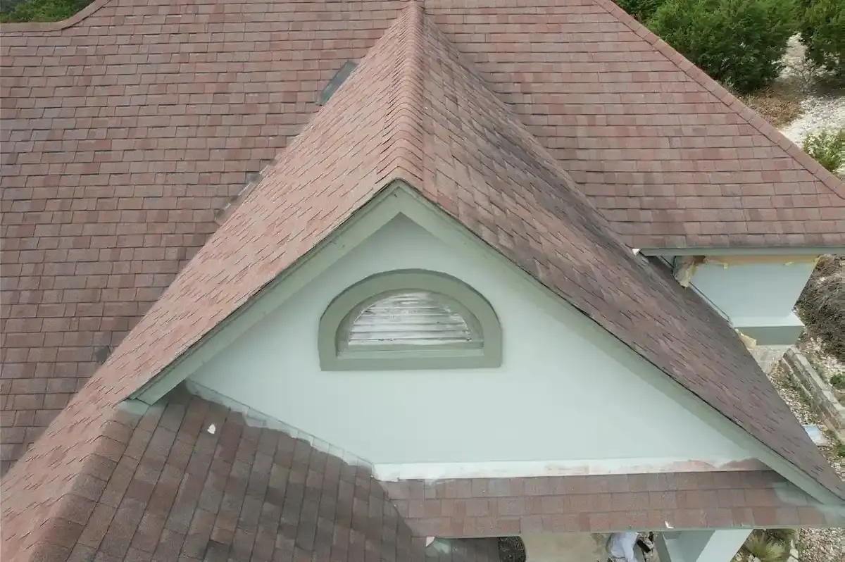 Brown shingle roof with a dormer vent on a Pflugerville home