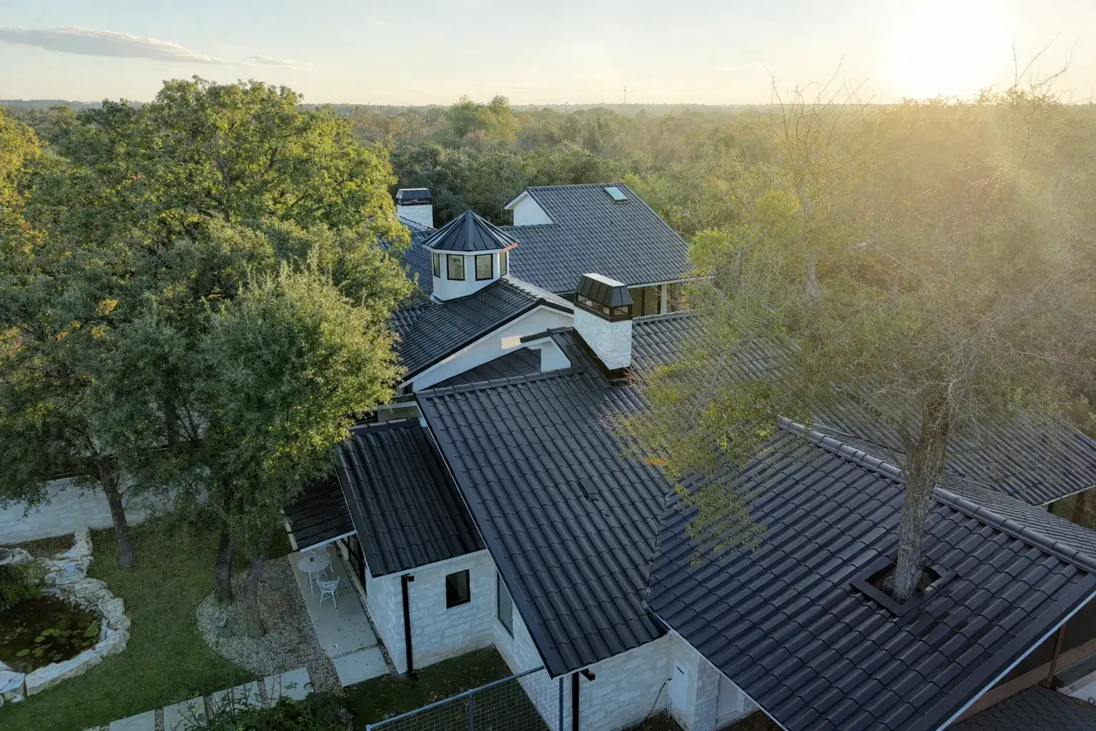 Central Texas rooftop at sunset where Ark installs roof ventilation