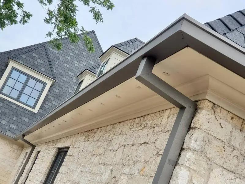 Box gutter installed on a stone Pflugerville home