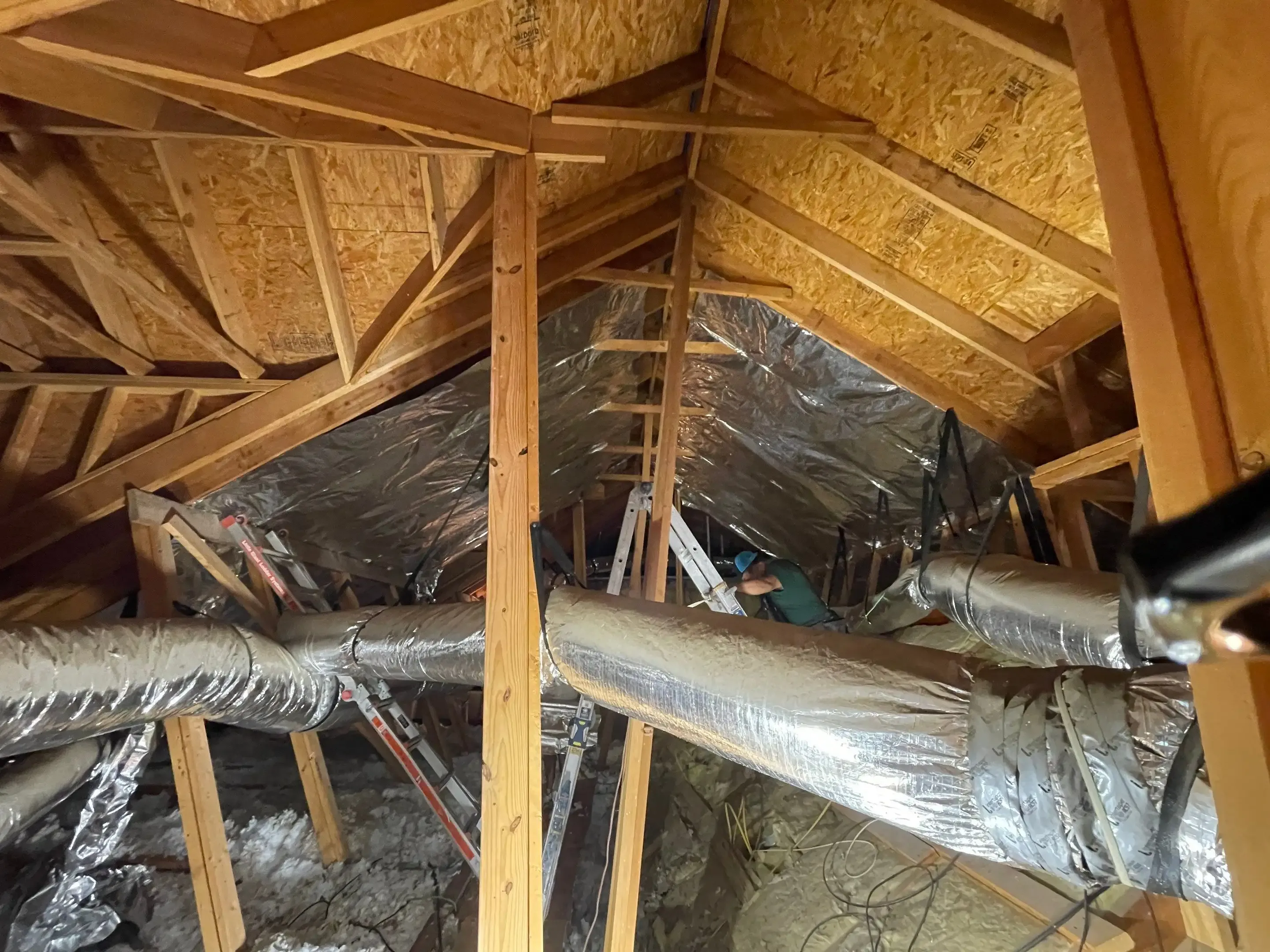 Ark Roofer team lined up in front of company trucks in Central Texas