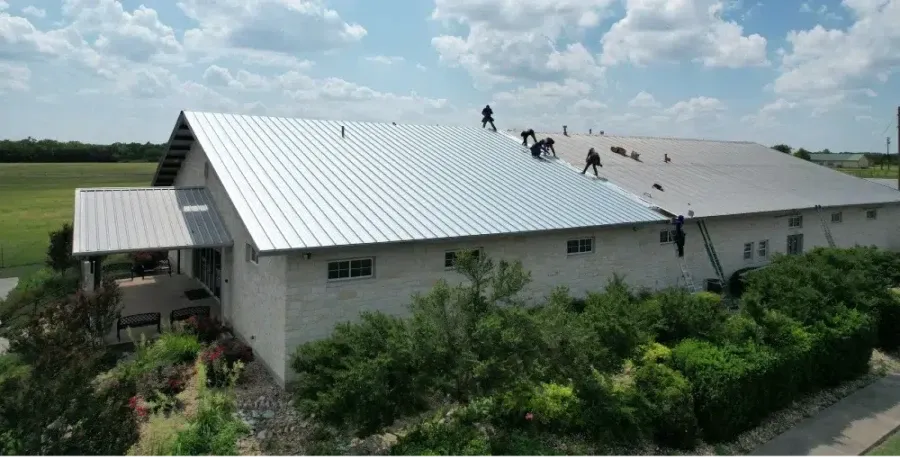 Ark crew replacing a commercial metal roof system in Round Rock