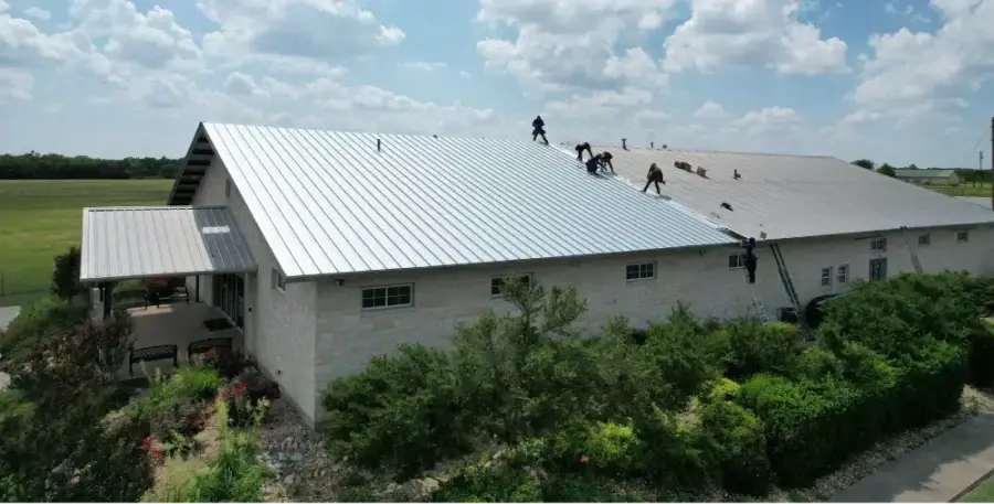 Ark crew replacing a commercial metal roof system in Pflugerville