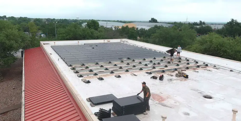 Ark crew performing technical commercial roof work in Pflugerville