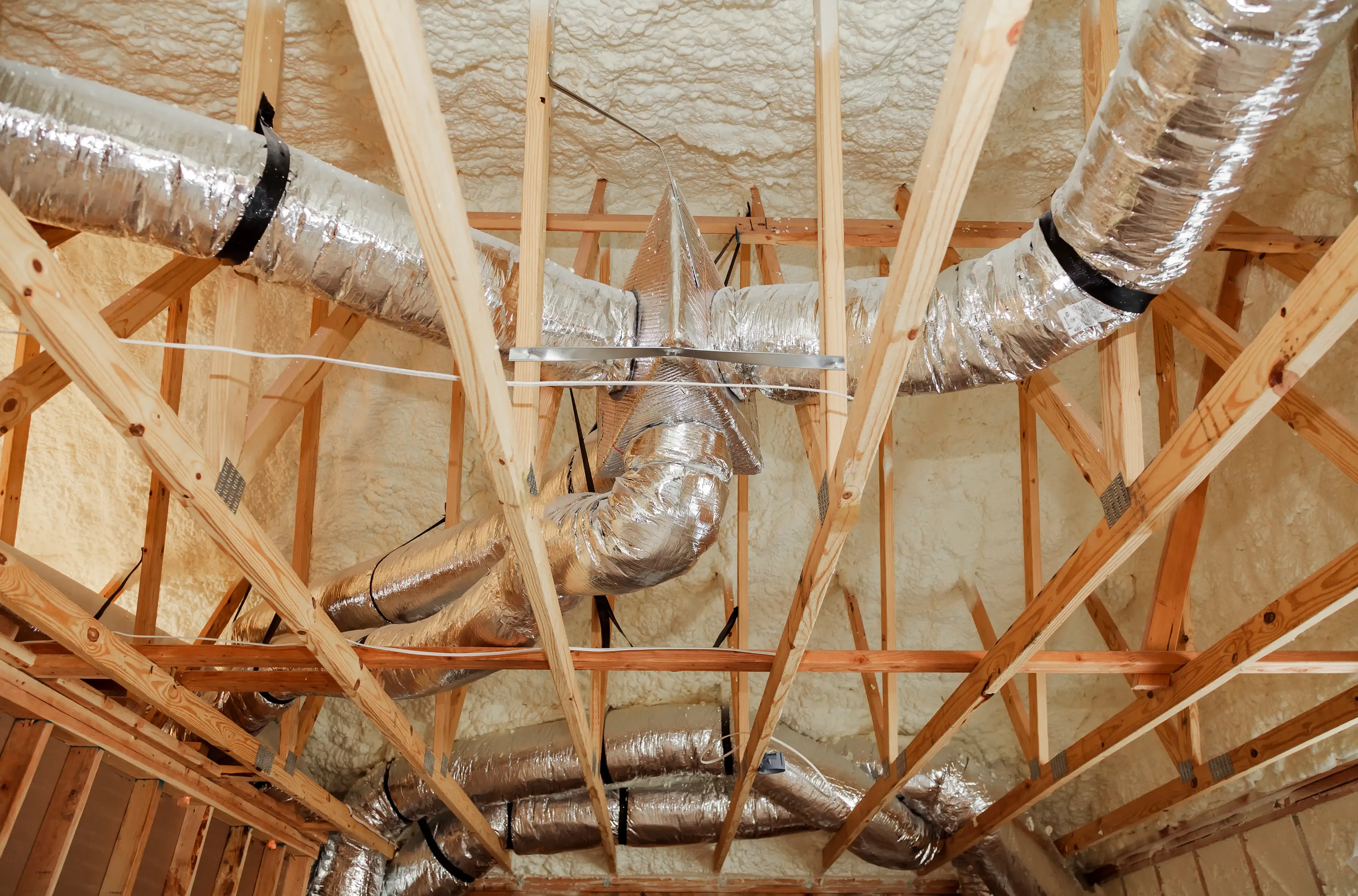 Professional exhaust ventilation system installation on residential roof