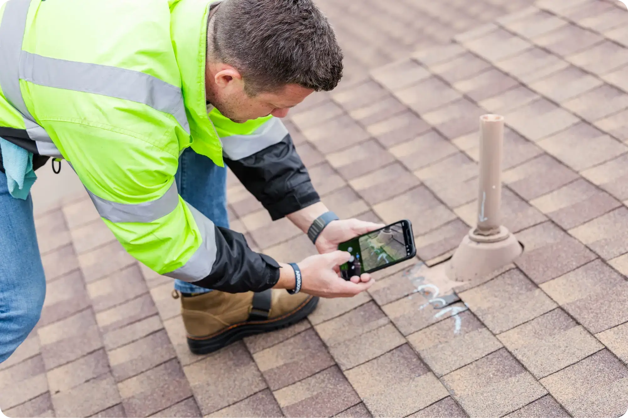 Roofer performing a roof inspection