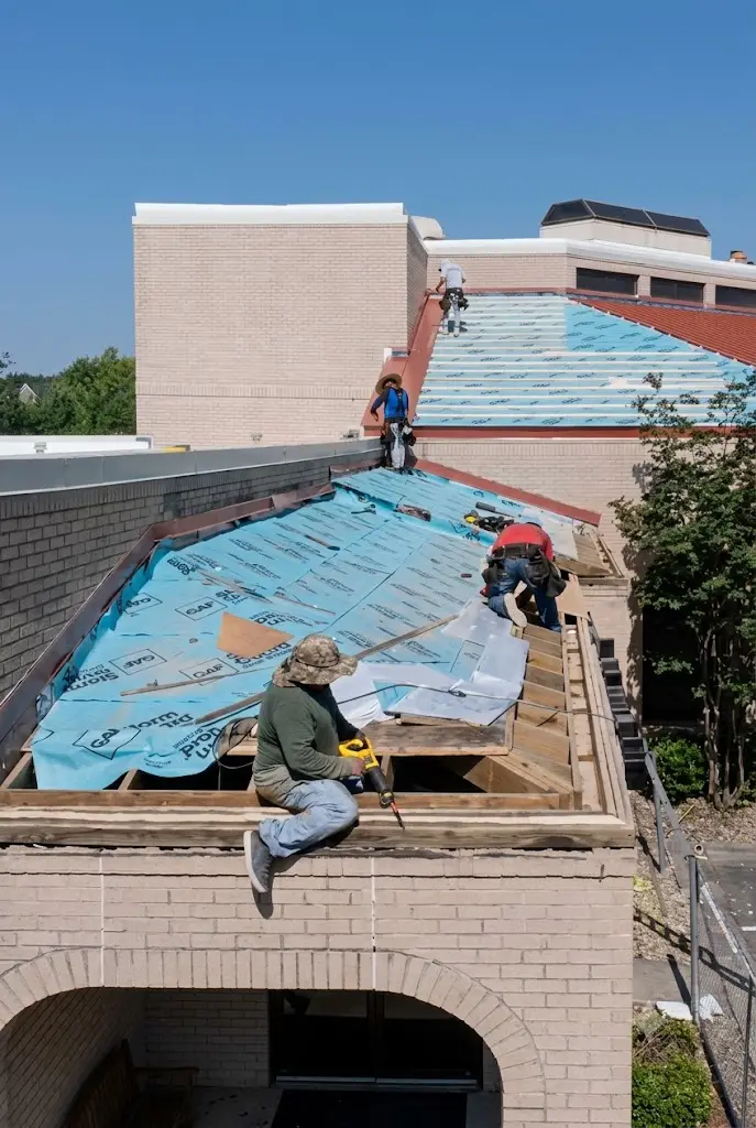 Ark crew repairing and replacing a hail-damaged Pflugerville roof