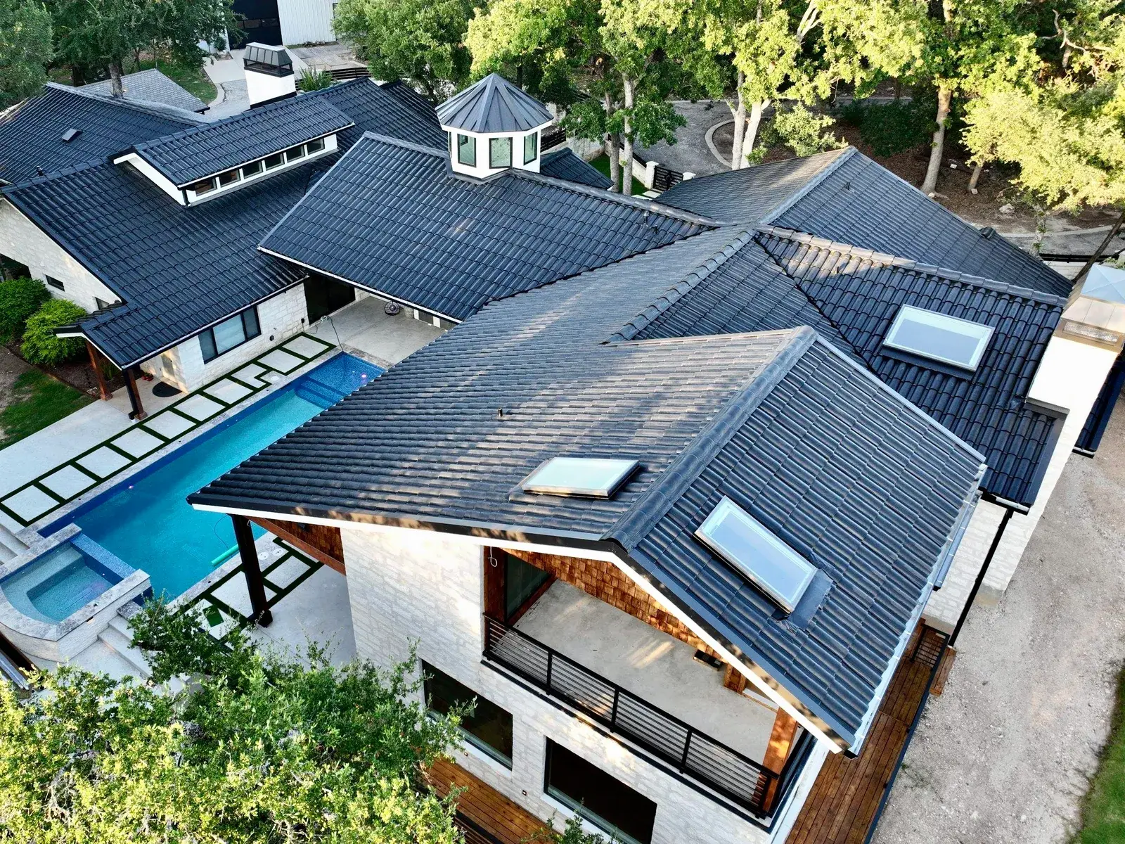 Close aerial of a RoofEco Spanish barrel tile roof profile on a Central Texas home
