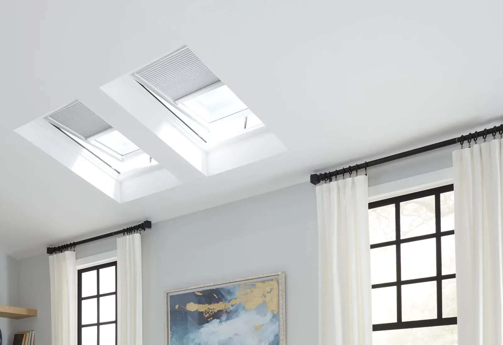 Two VELUX skylights set into the ceiling of a bright living room
