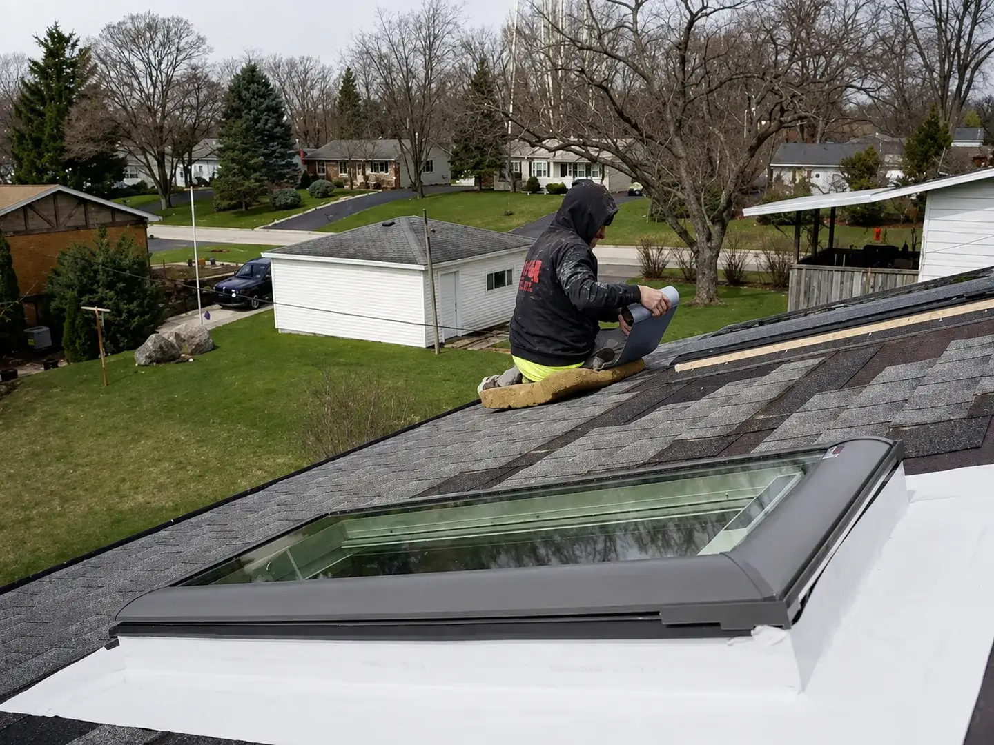 New skylight flashed and sealed into a shingle roof