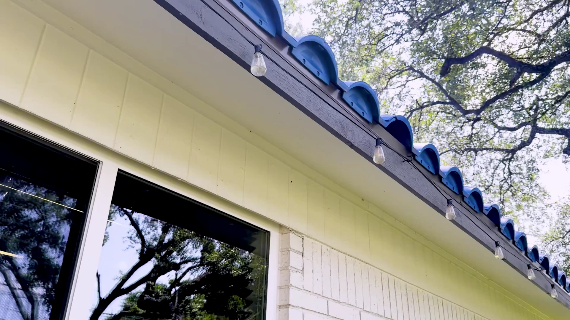 Solid soffit with no visible intake vents on the Ark Roofer office