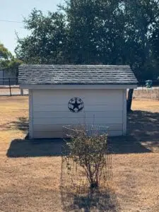 Exposed fiberglass shining through shingles