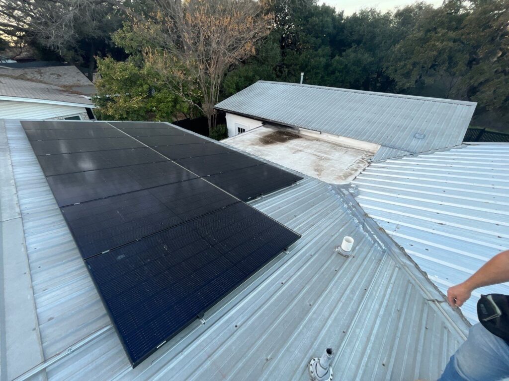 Metal roof with solar panels installed.