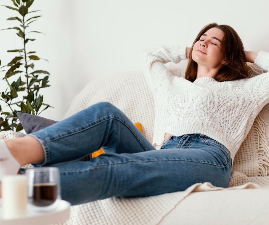 Woman relaxing on couch at home.