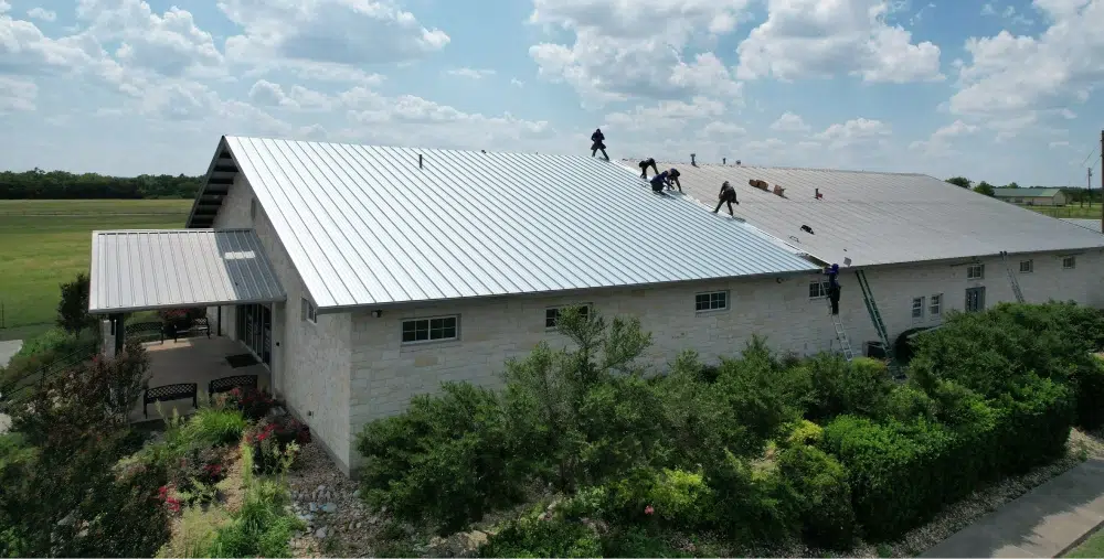 Large metal roof installation in progress.