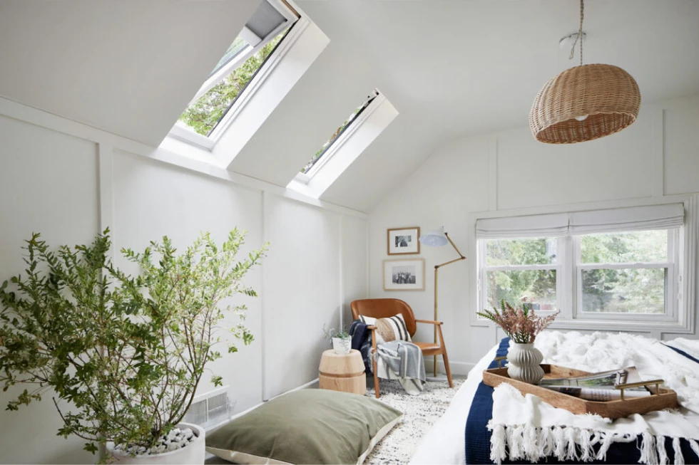 Bright bedroom with skylights and cozy decor.