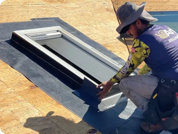 Ark roof worker inspecting a skylight window