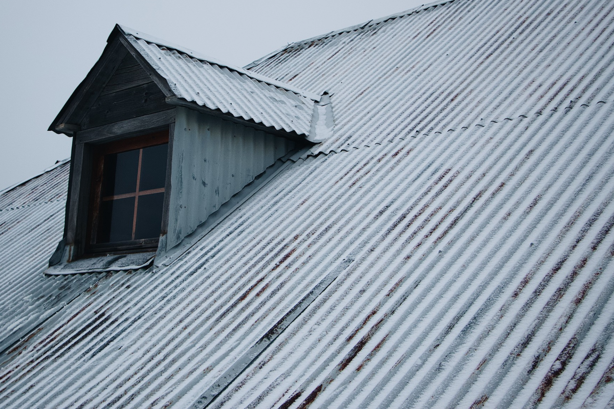 Metal roof covered in snow.