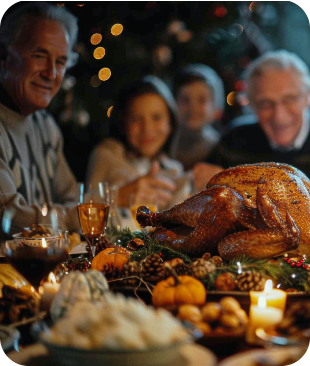 Family gathered around a festive dinner table with roasted turkey.