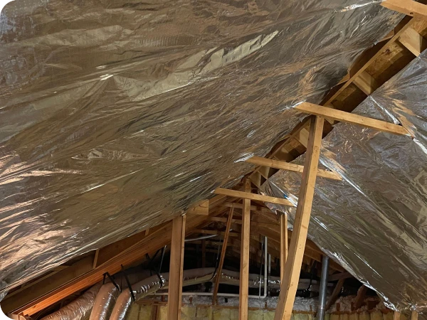 Insulation material installed in the attic for energy efficiency.